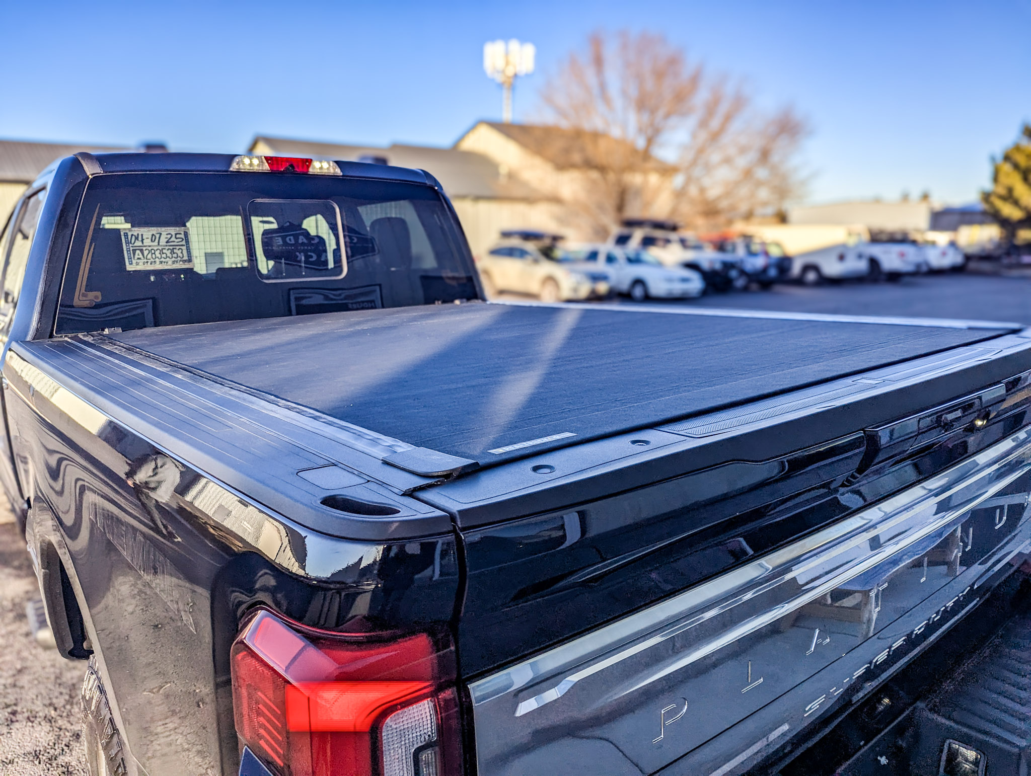 2024 Ford F-250 - Tonneau Cover and Side Steps - Bak Revolver X4s and AMP Research PowerStep Running Board